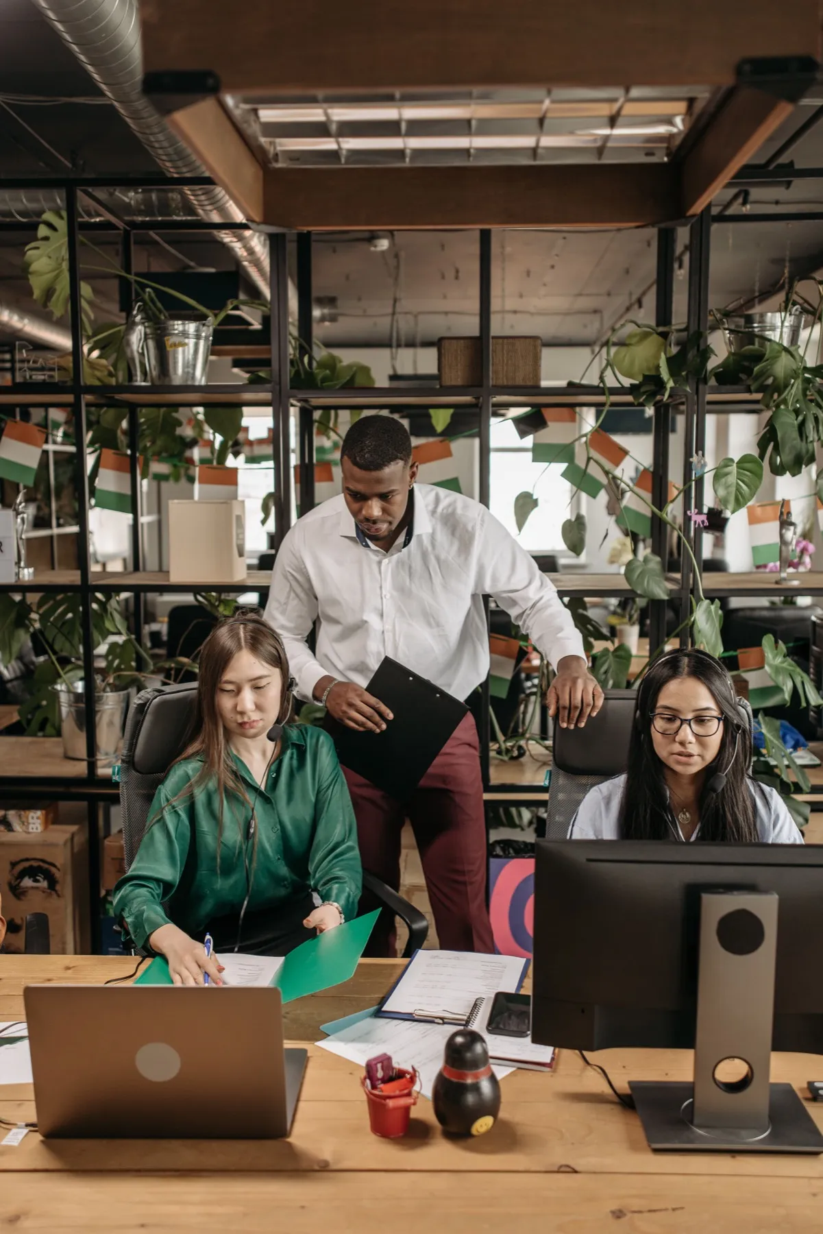 Diverse Flexus delivery team collaborating in a modern office