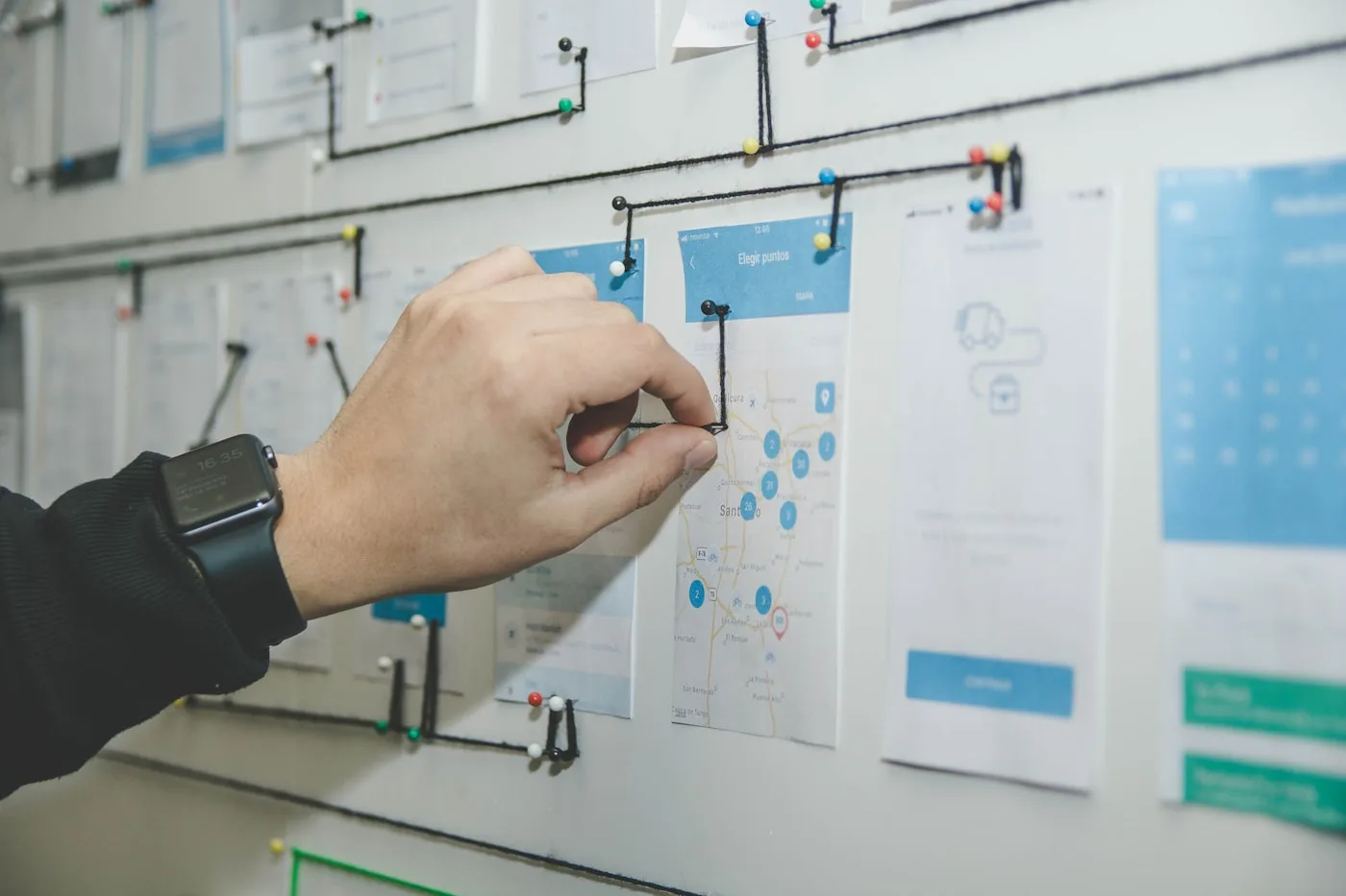 Flexus team reviewing an engagement roadmap on a wall