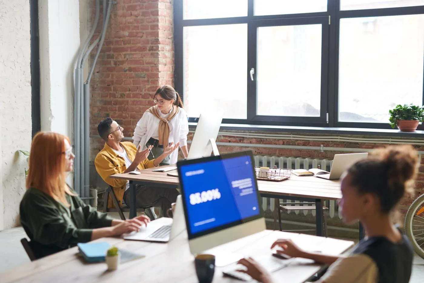 Designers refining UI components on screen