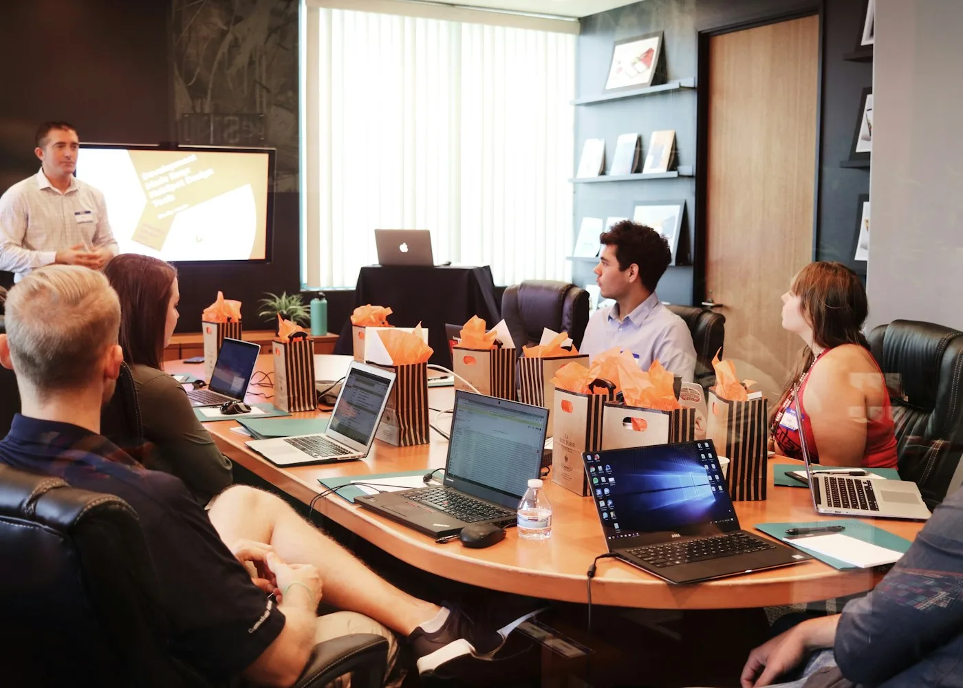 Strategy workshop with sticky notes and laptops