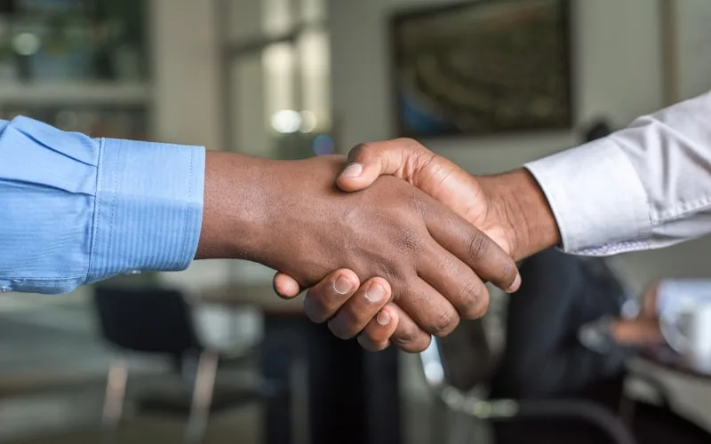 Handshake sealing an honest partnership between client and agency