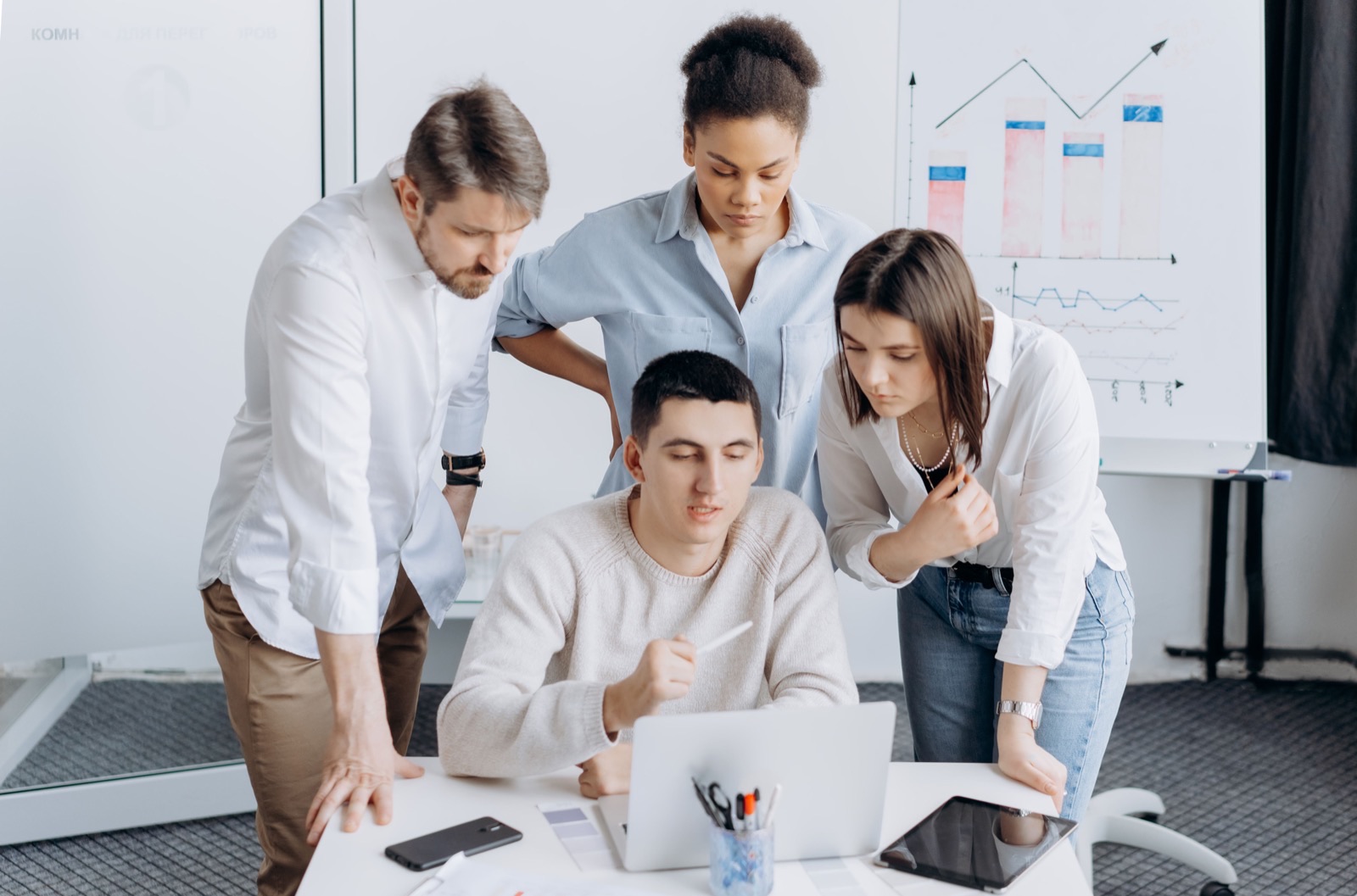 Professionals reviewing charts during an MVP planning session