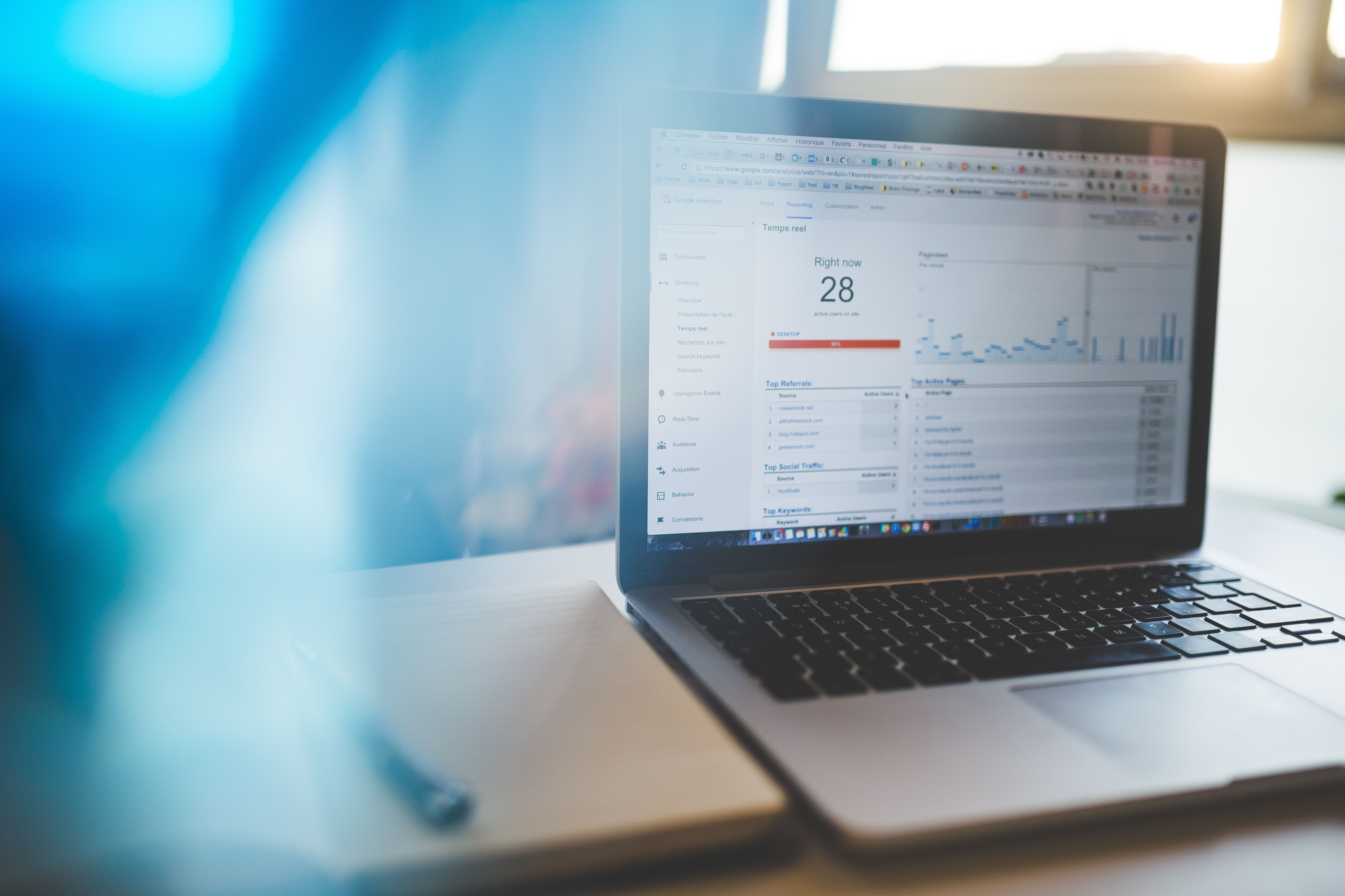 Google Analytics open on a laptop in a modern workspace
