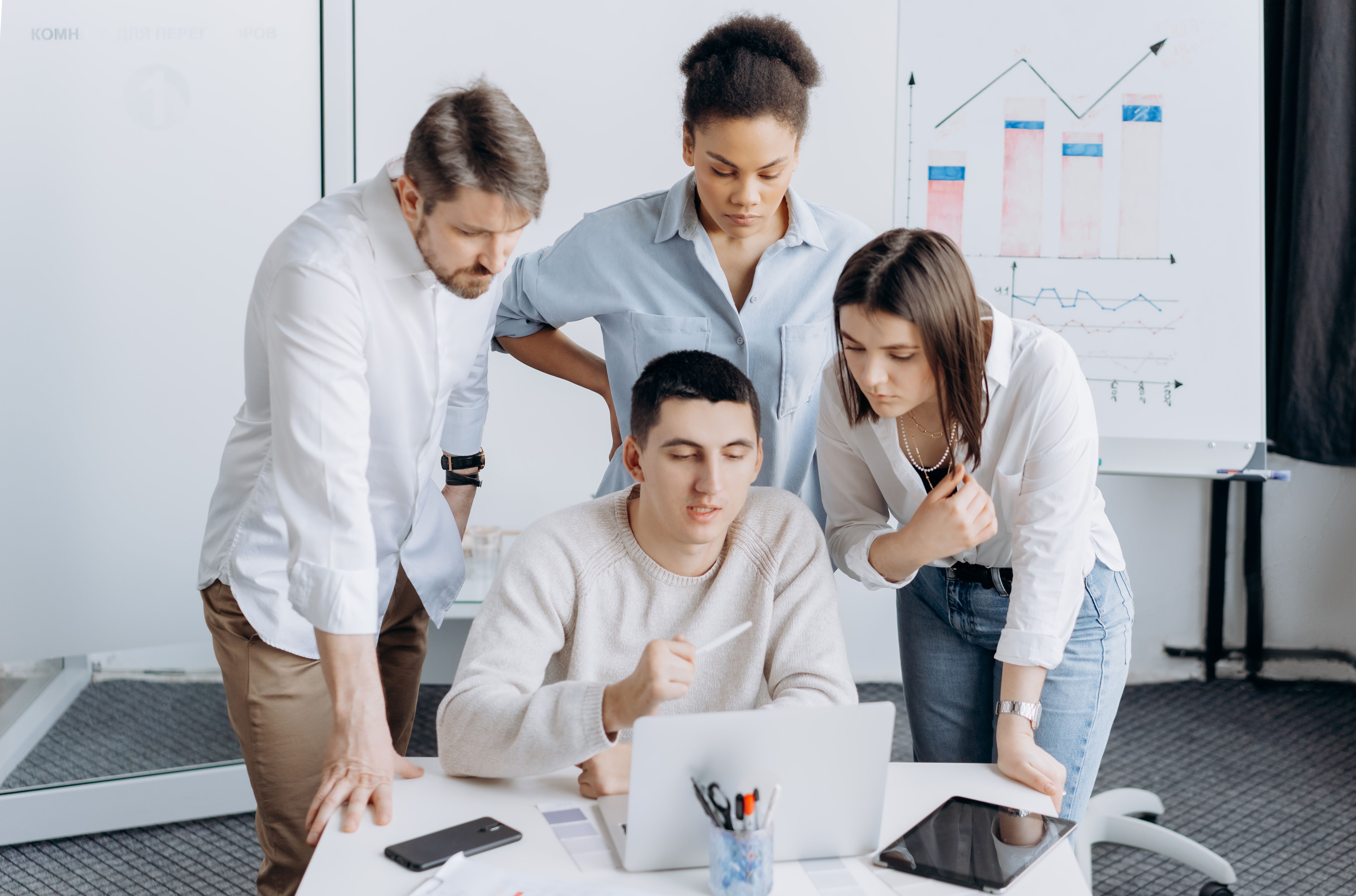 Professionals collaborating on growth strategy with charts