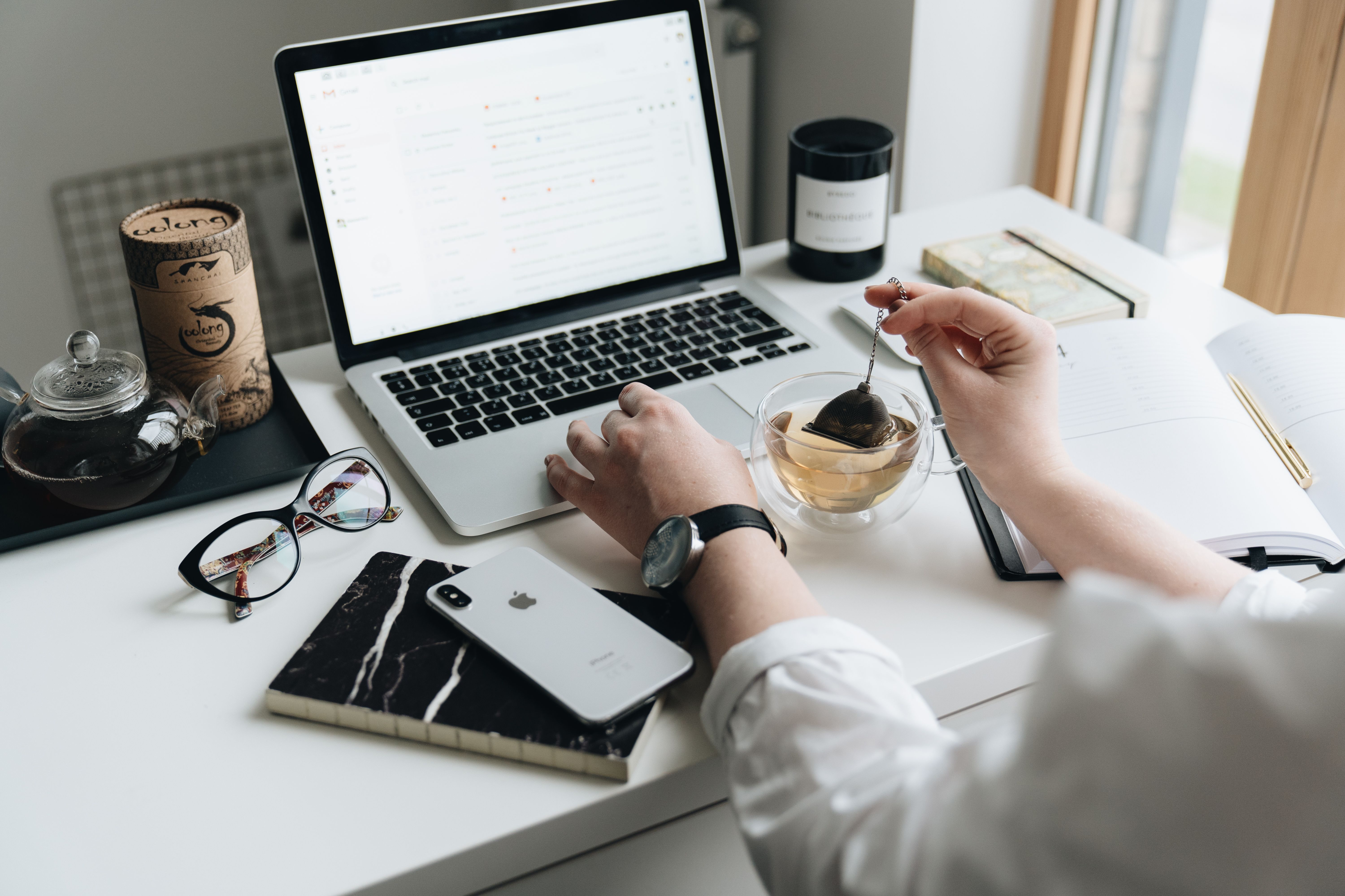 Laptop open on a desk for email marketing campaign work