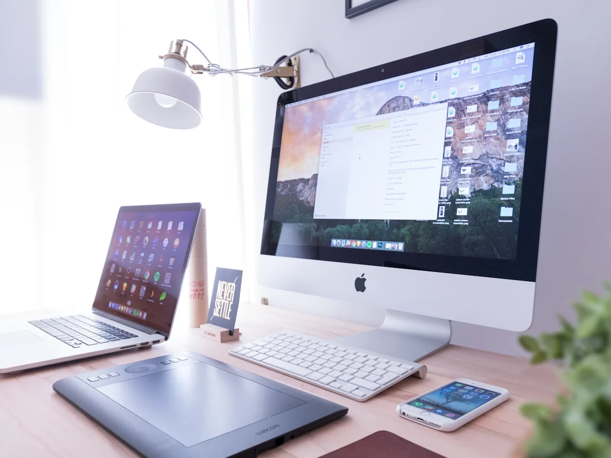 Design workstation with wireframes, brand systems, and conversion layouts