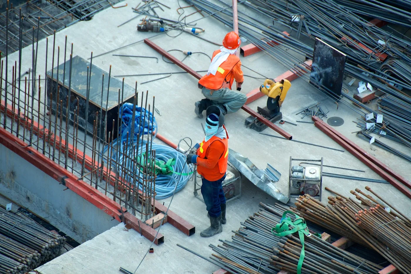 Construction project leads reviewing plans on a job site