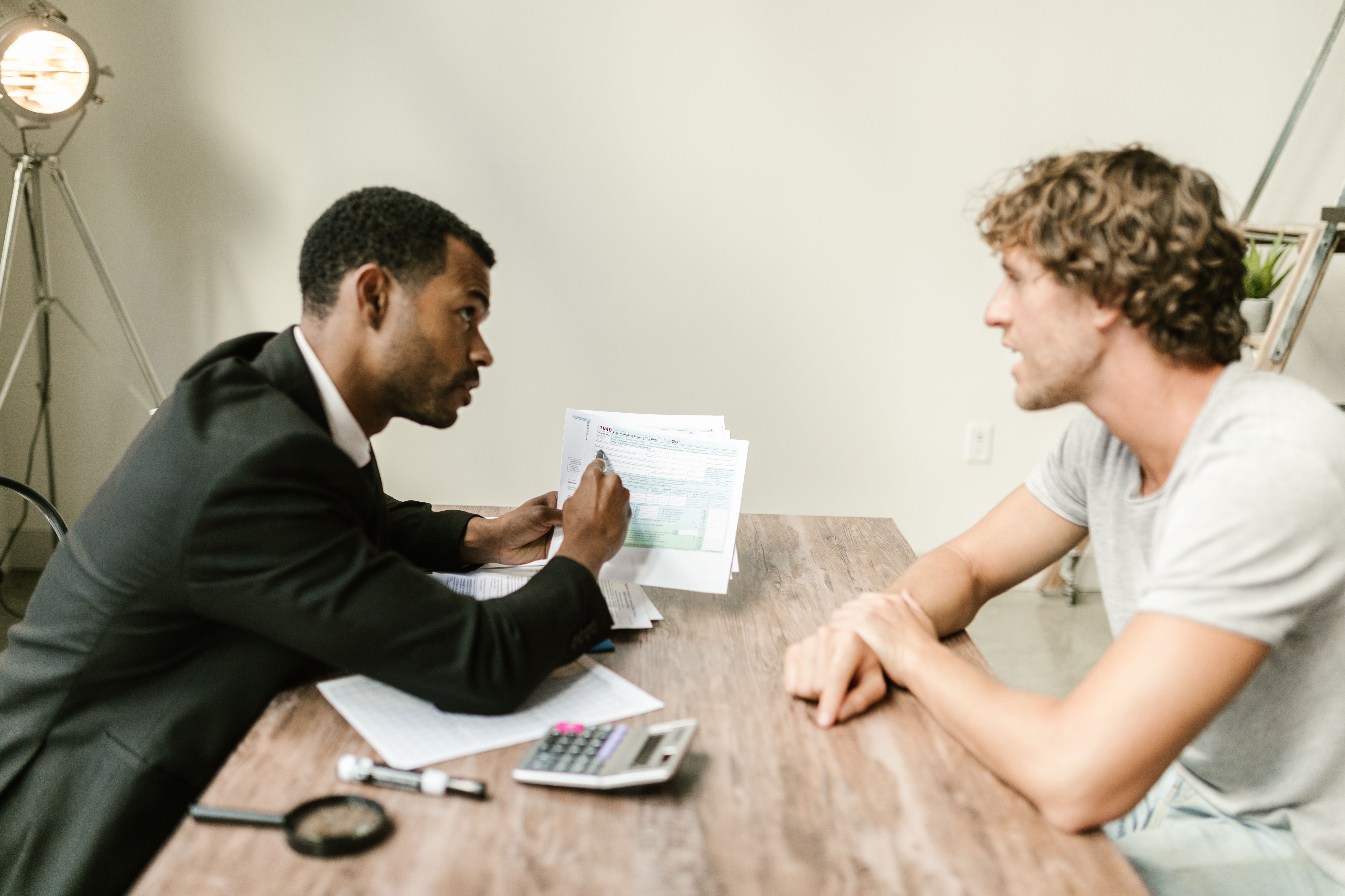 Financial advisors reviewing client-facing digital tools in a modern office