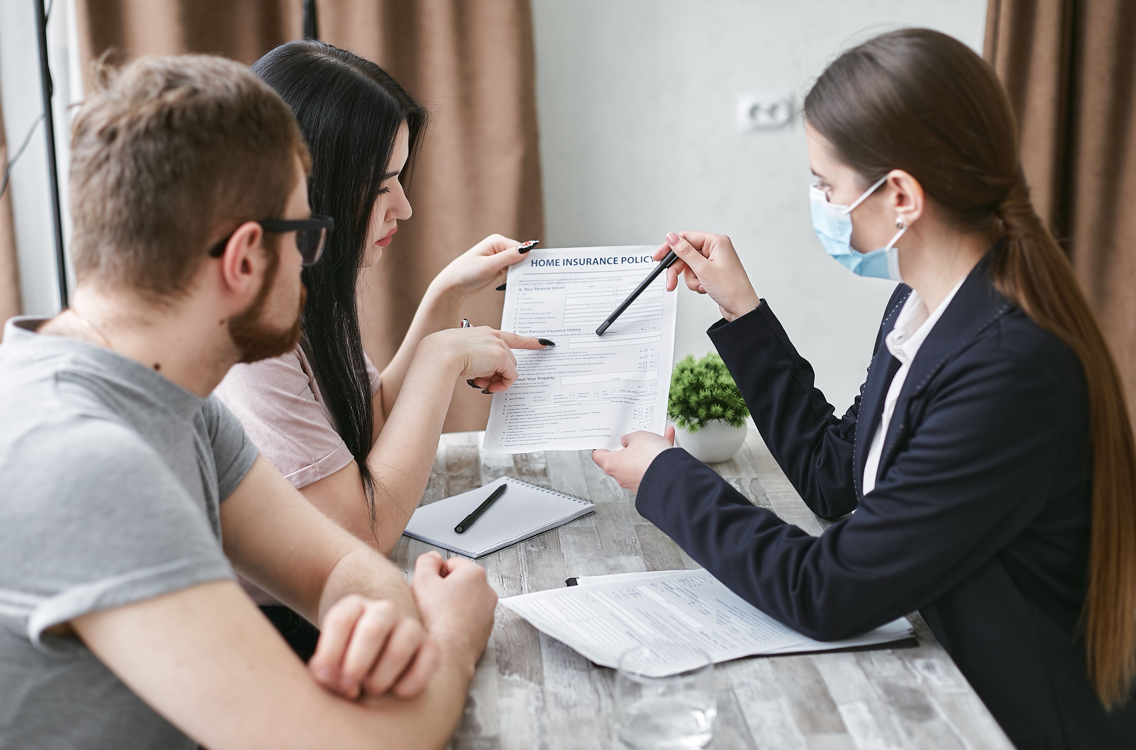 Insurance advisors reviewing client quote and coverage digital tools