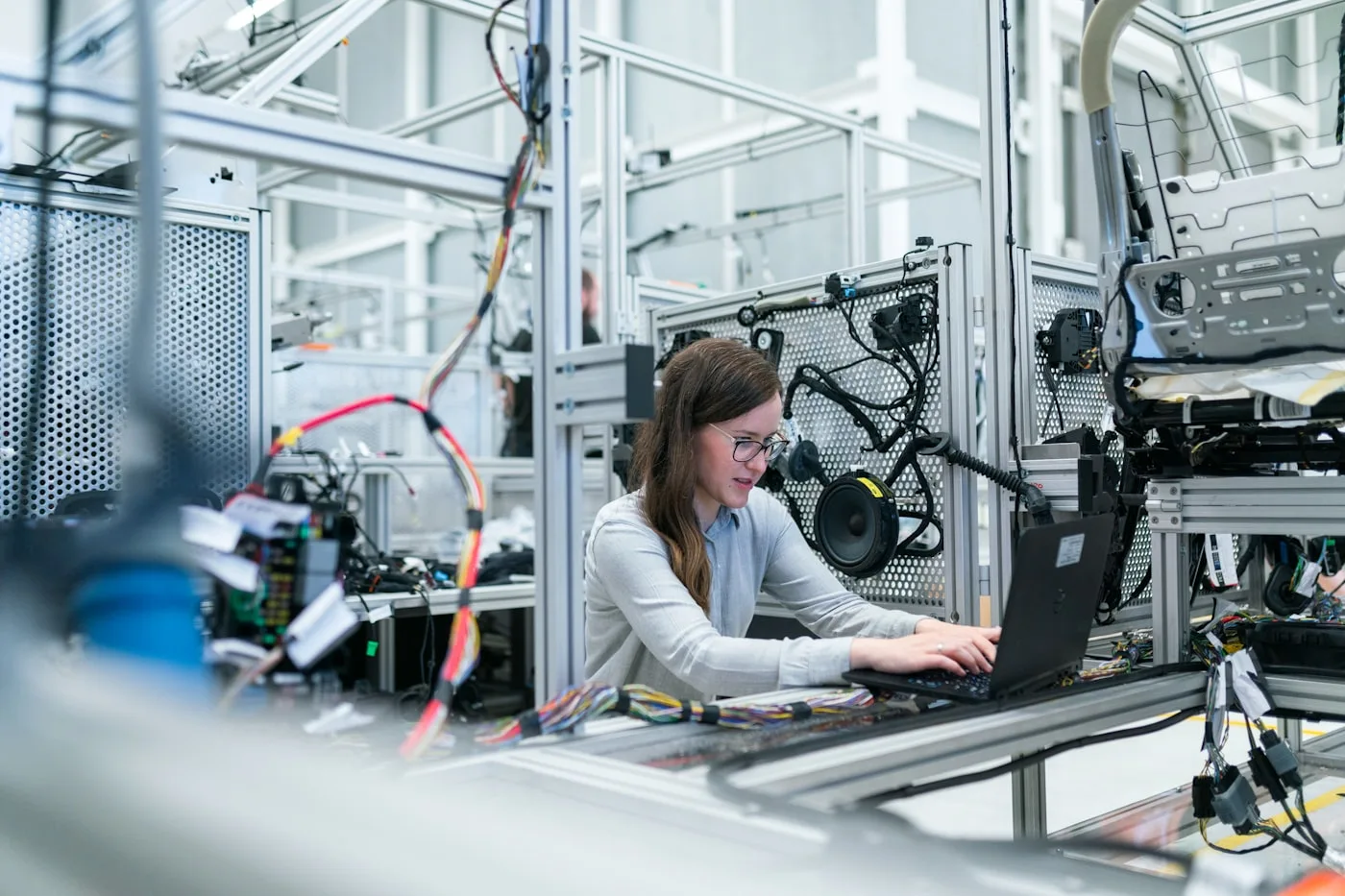Manufacturing engineers reviewing production systems and digital specs