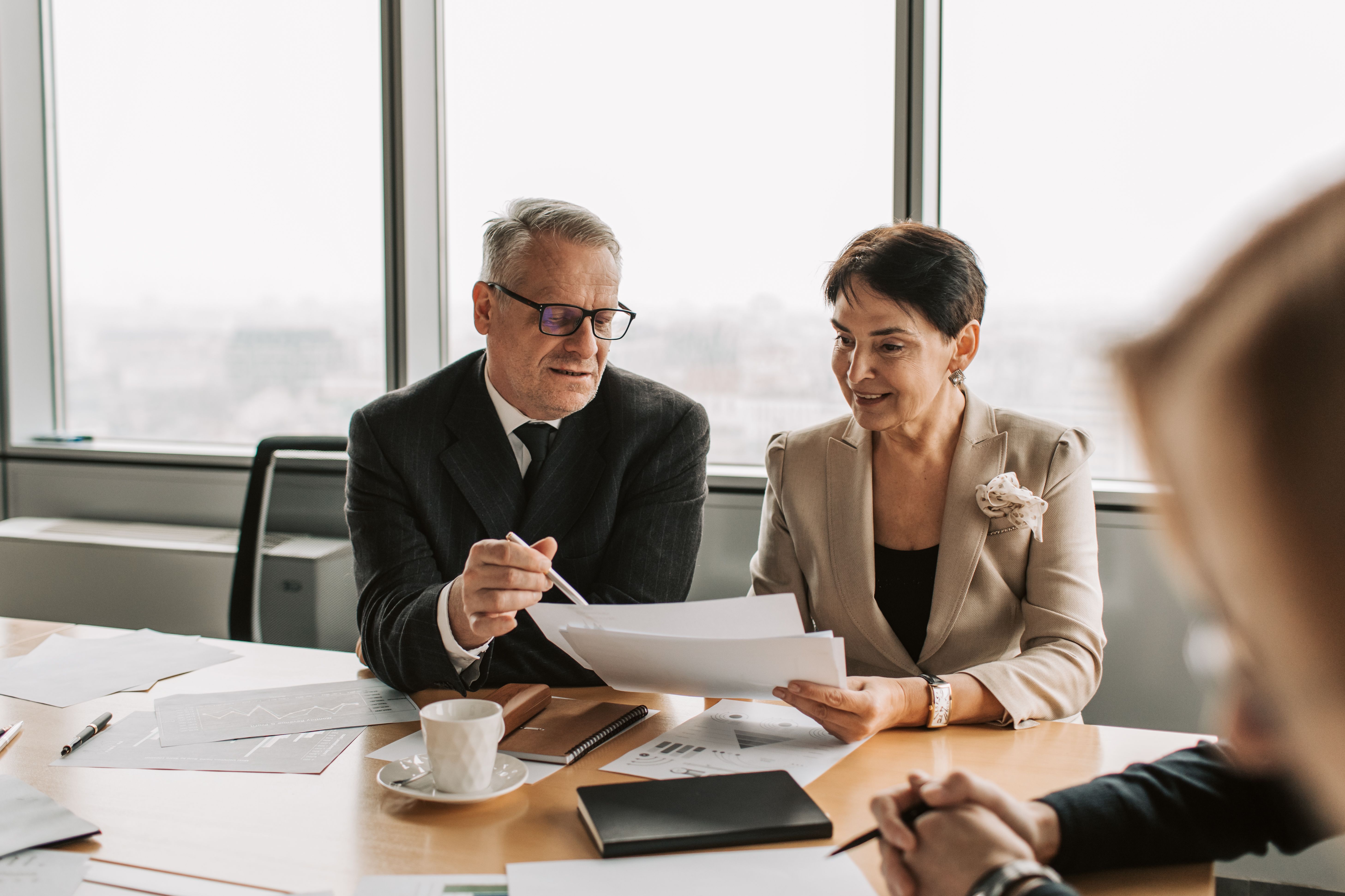 Professional services team reviewing client strategy in a modern office