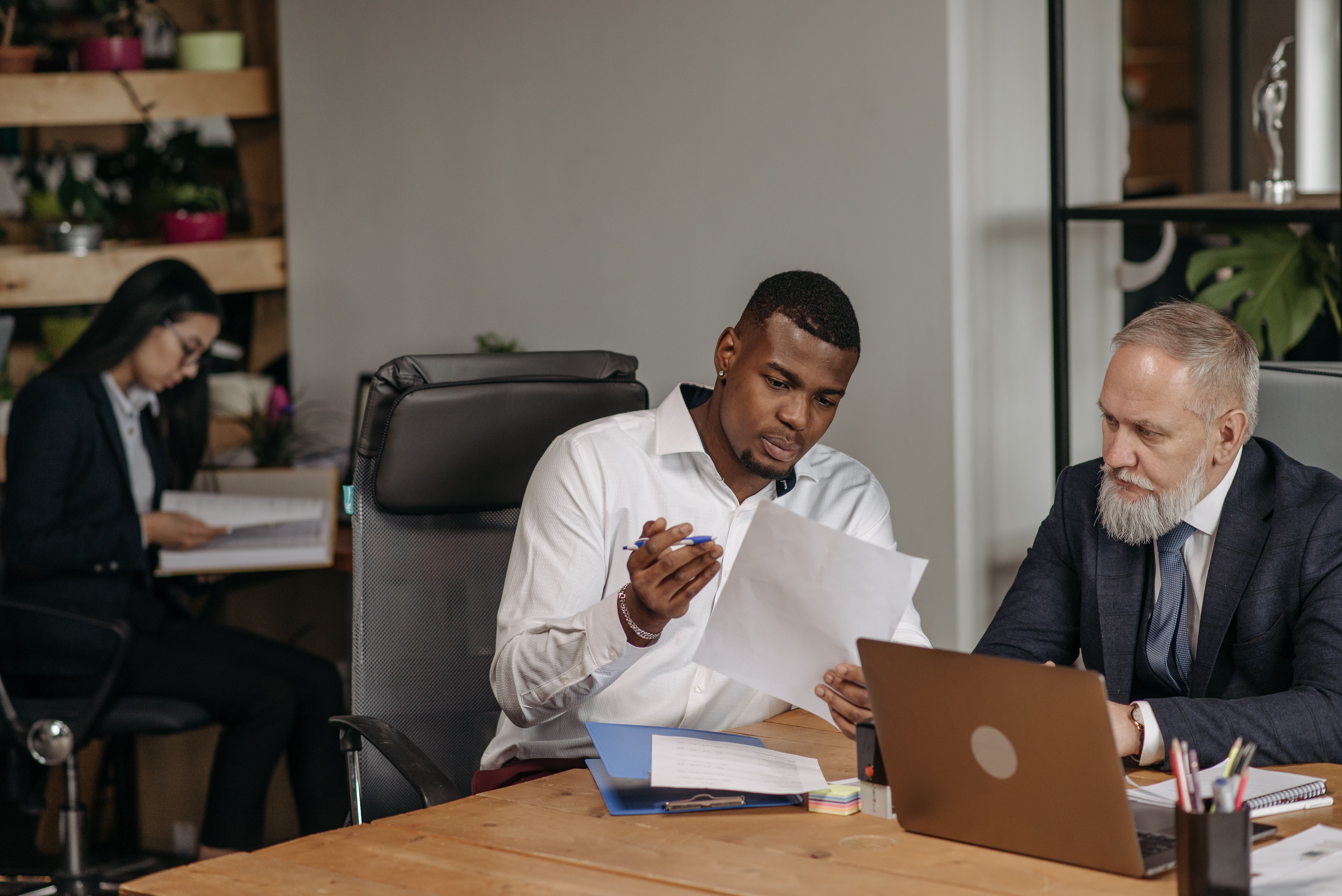 Advisors collaborating on digital client acquisition workflows