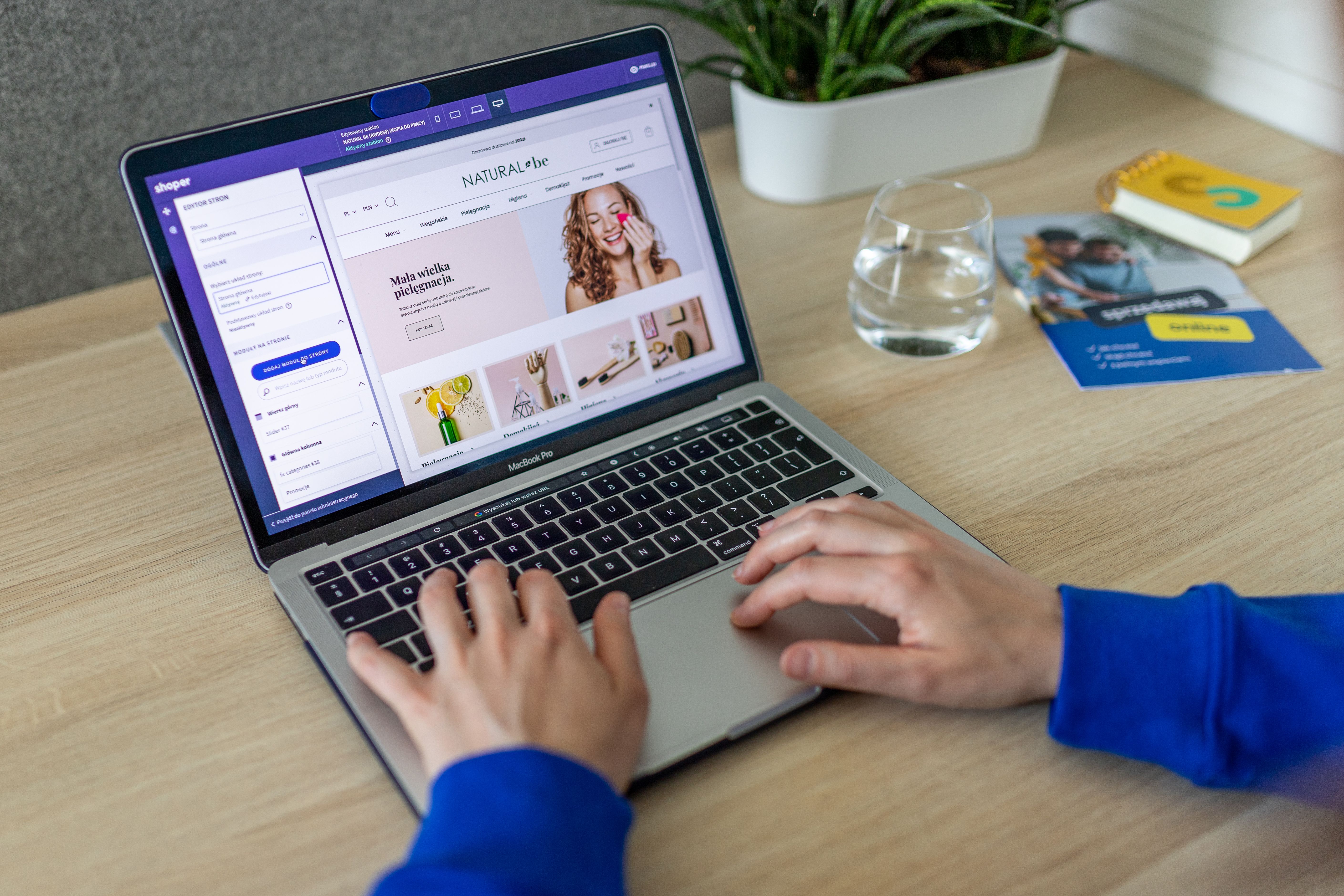 Laptop open to an ecommerce product page in a modern office