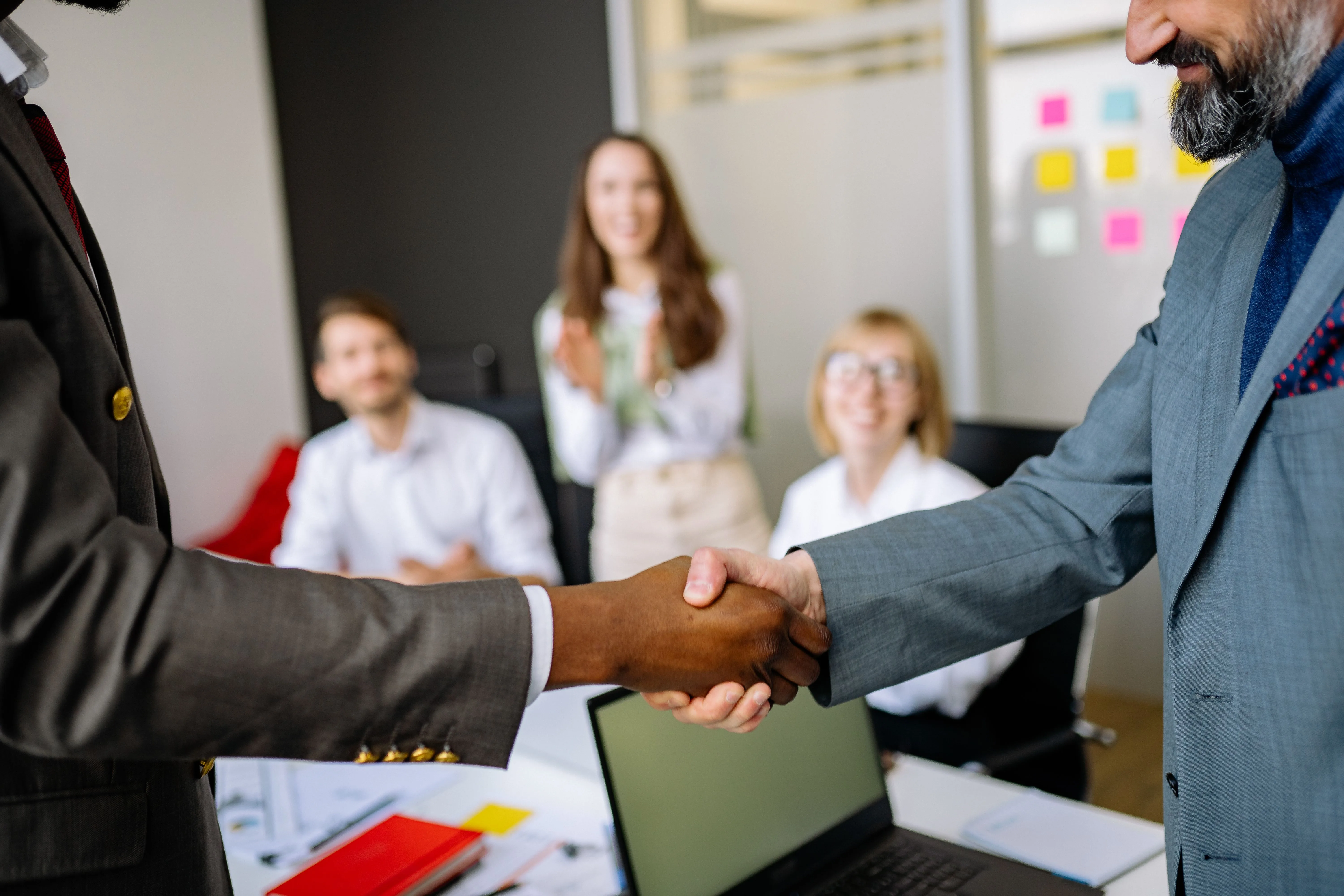 Professional handshake between colleagues in an office partnership meeting