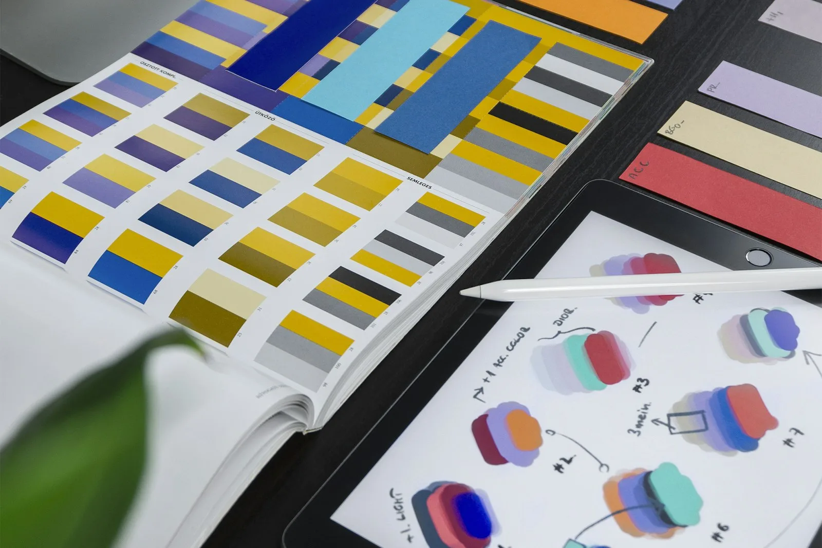Designer refining color systems and UI direction on a tablet