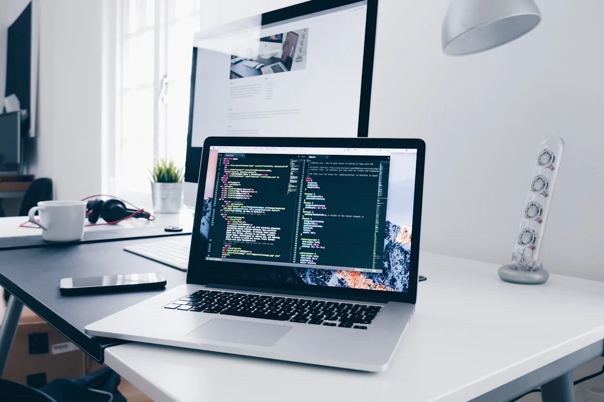 Software engineer building a custom web application on laptop